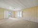 Open living room with access to the screened porch at 134 Lake Hazel Dr, Winter Haven, FL 33884