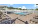 Relaxing community pool with lounge chairs and shade at 134 Lake Hazel Dr, Winter Haven, FL 33884