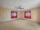 Large main bedroom with neutral walls and carpeting at 134 Lake Hazel Dr, Winter Haven, FL 33884