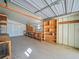 Workshop with wooden shelving units and workbenches at 134 Lake Hazel Dr, Winter Haven, FL 33884