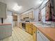 Full kitchen with appliances and laundry area at 134 Lake Hazel Dr, Winter Haven, FL 33884