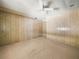 Large bedroom with two doors and carpeted floors at 134 Lake Hazel Dr, Winter Haven, FL 33884