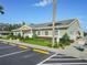 Community clubhouse with parking and landscaping at 134 Lake Hazel Dr, Winter Haven, FL 33884