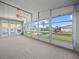 Bright screened porch with view of the community at 134 Lake Hazel Dr, Winter Haven, FL 33884