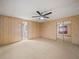 Spacious main bedroom with ceiling fan and mirrored closet at 134 Lake Hazel Dr, Winter Haven, FL 33884