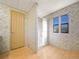 Bathroom featuring a shower stall and patterned wallpaper at 134 Lake Hazel Dr, Winter Haven, FL 33884