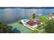 Community clubhouse, pool, tennis court, lake view at 17 Loma Verde # 17, Lakeland, FL 33813