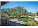 View of a tree-lined community from a balcony at 17 Loma Verde # 17, Lakeland, FL 33813