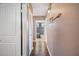 Hallway with light walls, wood flooring, and access to bedroom at 17 Loma Verde # 17, Lakeland, FL 33813