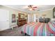 Comfortable main bedroom with dresser and ensuite bathroom access at 17 Loma Verde # 17, Lakeland, FL 33813