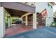 Covered carport area with storage and seating at 17 Loma Verde # 17, Lakeland, FL 33813