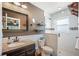 Updated bathroom with granite vanity, tiled shower, and modern fixtures at 17 Loma Verde # 17, Lakeland, FL 33813