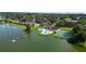 Aerial view of community pool, tennis courts, and lake access at 17 Loma Verde # 17, Lakeland, FL 33813