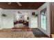 Sunroom offering view into living room with hardwood floors at 1806 17Th Nw St, Winter Haven, FL 33881