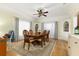 Formal dining room featuring a wood table and hardwood floors at 1806 17Th Nw St, Winter Haven, FL 33881