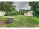 Large backyard with grassy area, shed, and playground swing set at 1806 17Th Nw St, Winter Haven, FL 33881