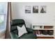 Relaxing living room area featuring a comfortable recliner chair and bookshelves at 1806 17Th Nw St, Winter Haven, FL 33881