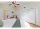 Spacious bedroom with hardwood floors, king bed, and built-in closet at 1806 17Th Nw St, Winter Haven, FL 33881
