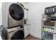 Bright laundry room with stackable washer and dryer, and ample storage at 1806 17Th Nw St, Winter Haven, FL 33881
