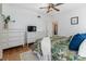 Bright bedroom with hardwood floors, king bed, and ample storage at 1806 17Th Nw St, Winter Haven, FL 33881