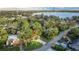 Aerial view of house with lake view in the background at 1806 17Th Nw St, Winter Haven, FL 33881