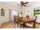 Formal dining room with built-in hutch and hardwood floors at 1806 17Th Nw St, Winter Haven, FL 33881