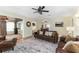Spacious living room with leather sofas, fireplace, and hardwood floors at 1806 17Th Nw St, Winter Haven, FL 33881