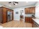 Bright kitchen featuring wood cabinets and granite countertops at 1806 17Th Nw St, Winter Haven, FL 33881
