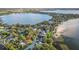 Aerial view showcasing a house near a lake with beautiful surroundings at 1806 17Th Nw St, Winter Haven, FL 33881