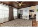 Sunroom with wood ceiling, window seating, and home office space at 1806 17Th Nw St, Winter Haven, FL 33881