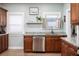 Kitchen with granite countertops, stainless steel appliances, and wood cabinets at 1806 17Th Nw St, Winter Haven, FL 33881