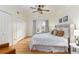 Charming bedroom with hardwood floors, a king-size bed, and ample closet space at 1806 17Th Nw St, Winter Haven, FL 33881