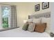 Cozy bedroom with king bed and decorative pillows, offering a tranquil atmosphere at 1806 17Th Nw St, Winter Haven, FL 33881