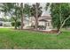 Spacious backyard with patio furniture and lush greenery at 1806 17Th Nw St, Winter Haven, FL 33881