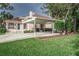 Home exterior showcasing carport and well-manicured lawn at 1806 17Th Nw St, Winter Haven, FL 33881