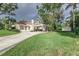 Charming house exterior with carport, landscaping, and detached shed at 1806 17Th Nw St, Winter Haven, FL 33881