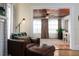 Cozy living room corner with leather armchair and ottoman at 1806 17Th Nw St, Winter Haven, FL 33881