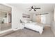 Main bedroom with barn door to ensuite bathroom and carpet at 2430 Old Homeland Rd, Bartow, FL 33830