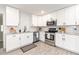 Modern kitchen with white shaker cabinets and granite countertops at 2430 Old Homeland Rd, Bartow, FL 33830