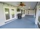 Large screened patio, great for entertaining, with TV mount and ceiling fans at 300 Winona Ct, Auburndale, FL 33823