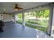 Serene screened patio offering backyard views and ceiling fan at 300 Winona Ct, Auburndale, FL 33823