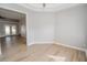 Bedroom with access to another room and hardwood floors at 300 Winona Ct, Auburndale, FL 33823