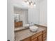 Modern bathroom with double vanity and granite countertop at 300 Winona Ct, Auburndale, FL 33823