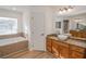Bathroom with a vanity, soaking tub and shower at 300 Winona Ct, Auburndale, FL 33823