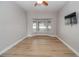Living room featuring bay window and hardwood floors at 300 Winona Ct, Auburndale, FL 33823