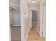 Bright hallway with light-colored walls and wood-look floors at 300 Winona Ct, Auburndale, FL 33823
