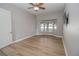 Spacious living room with hardwood floors and large windows at 300 Winona Ct, Auburndale, FL 33823