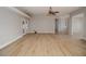 Bright living room featuring hardwood floors and access to other rooms at 300 Winona Ct, Auburndale, FL 33823