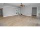 Spacious living area with hardwood floors and sliding glass doors at 300 Winona Ct, Auburndale, FL 33823
