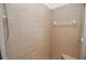 Clean shower with tiled walls and built-in seat at 300 Winona Ct, Auburndale, FL 33823